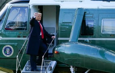 President Donald Trump gestures as he boards Marine One on the South Lawn of the White House,